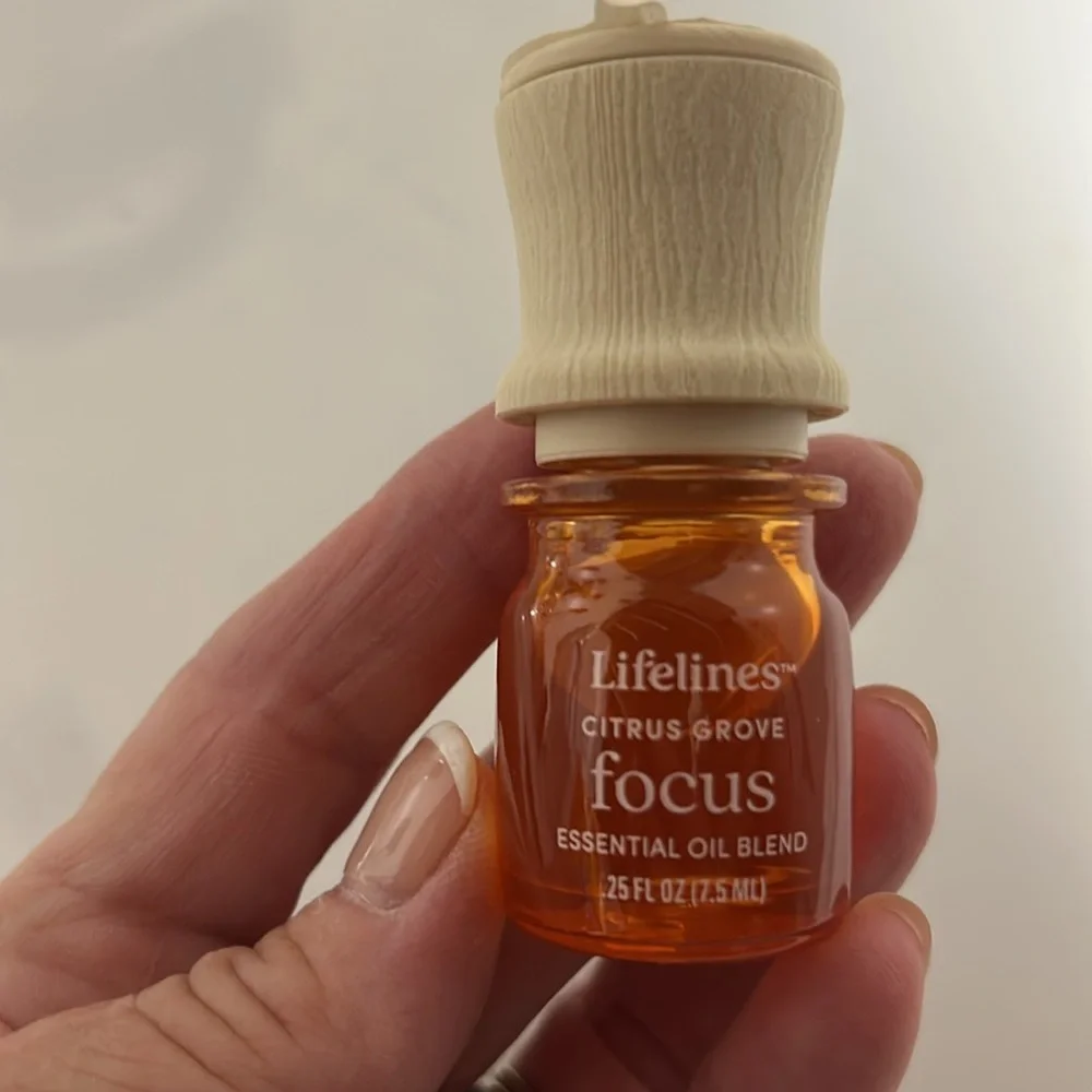 White Ceramic Aromatherapy Diffuser with a bottle of FOCUS essential oil